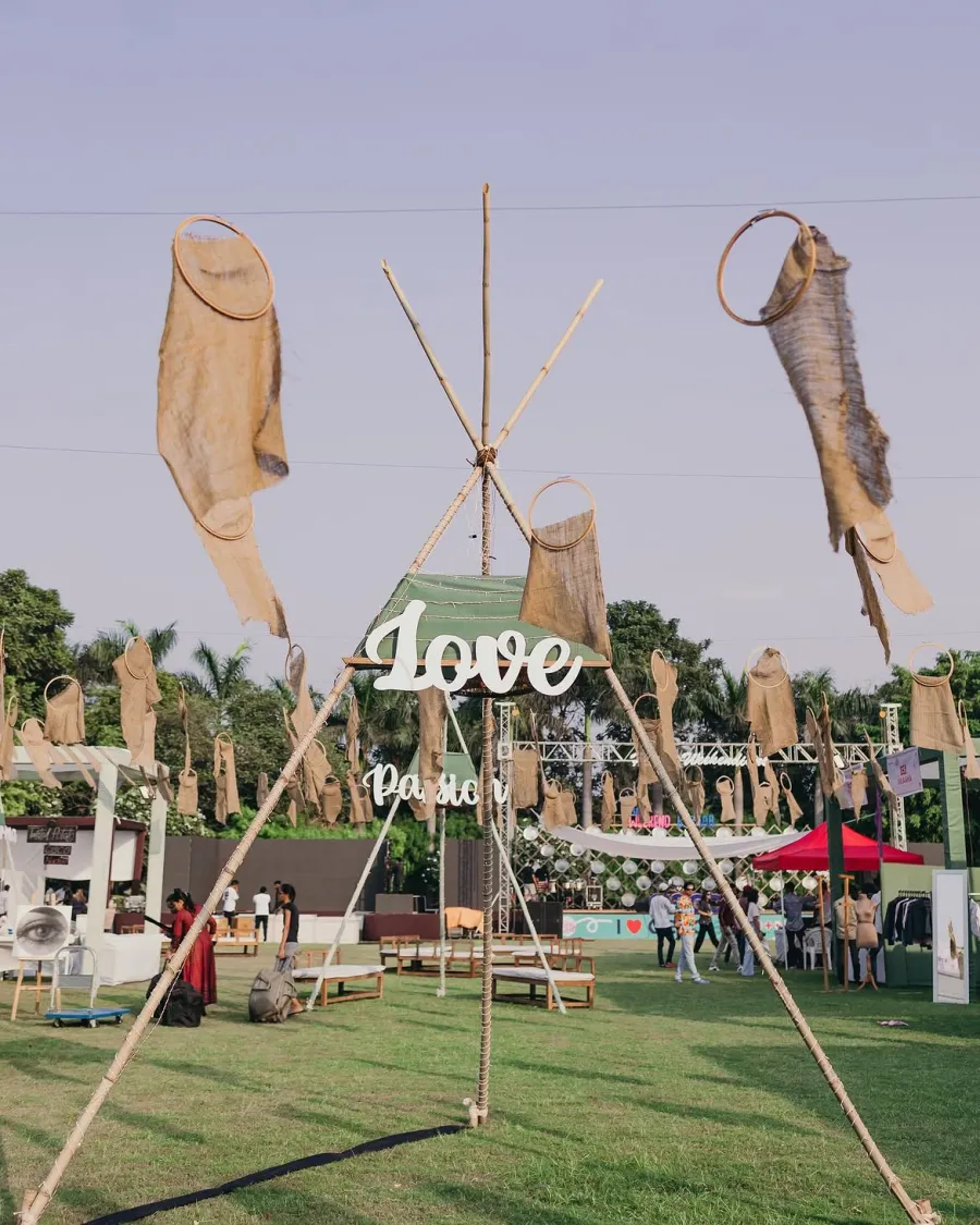 A bamboo installation hung with jute banners and a Love sign on the Weekend Bazaar lawn