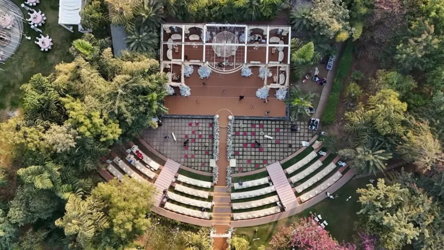 Aerial view of a tiered garden amphitheatre laid out for a ceremony