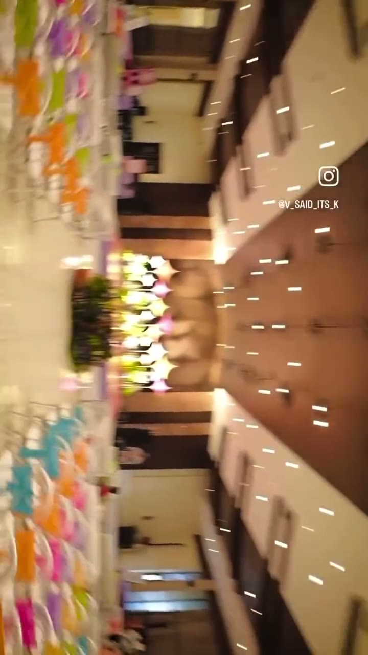 Colourful hanging installation over a decorated hall