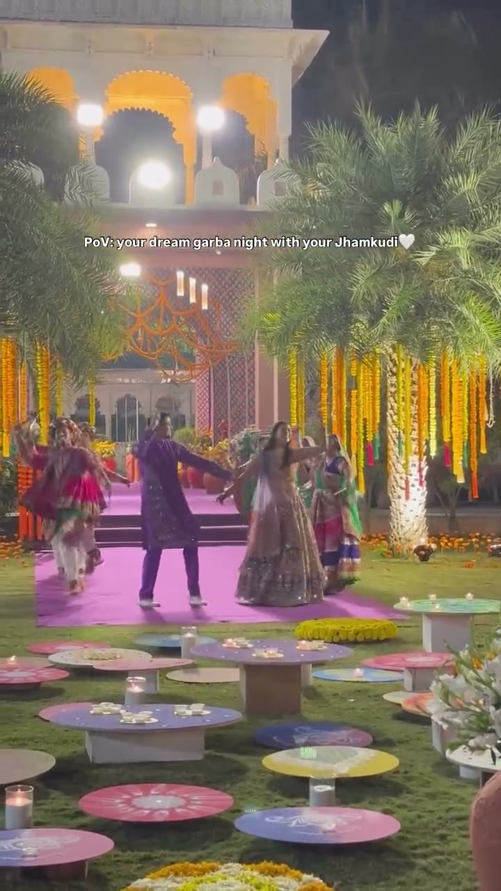 Guests walking a marigold-lined garden pathway