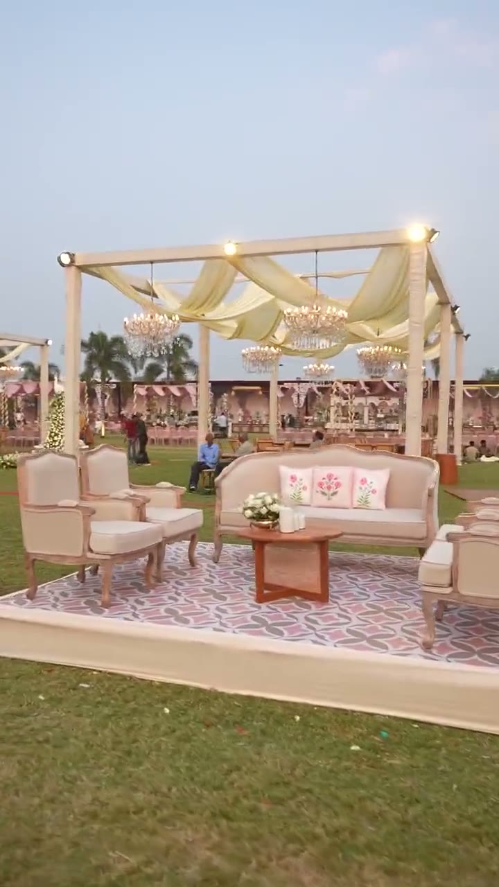 A mandap structure being assembled in daylight